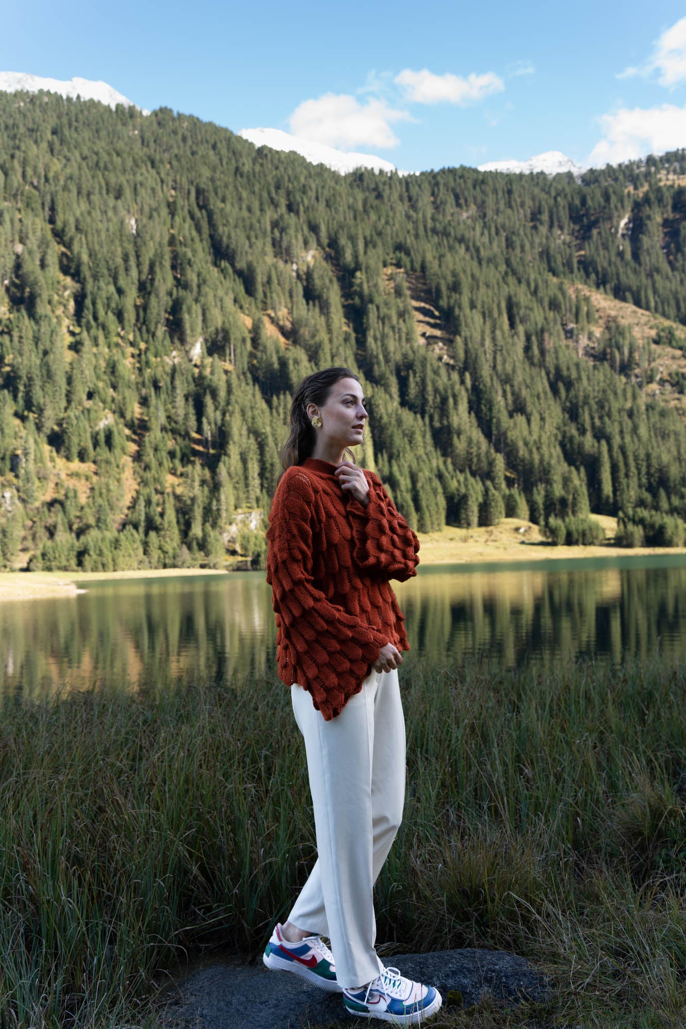 Red knitted sweater with wide sleeves